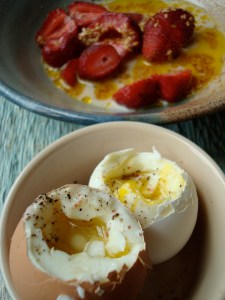 Soothing breakfast: soft-boiled eggs and strawberries